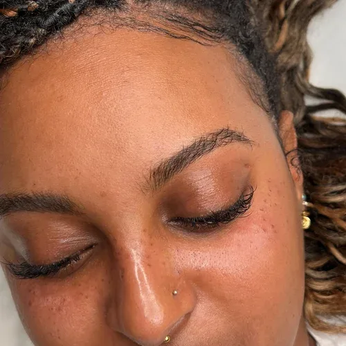 Deep-skin brow result with freckles