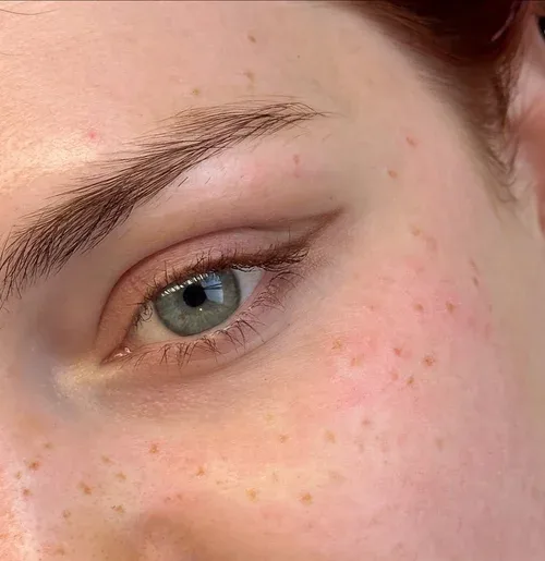 Brow and eye close-up showing cosmetic tattoo result