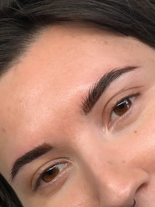 Eyebrow tattoo result close-up by Little Feather Cosmetic Tattoo